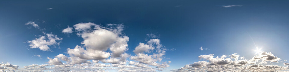 Seamless hdri panorama 360 degrees angle view blue sky with beautiful cumulus clouds with zenith for use in 3d graphics or game development as sky dome or edit drone shot