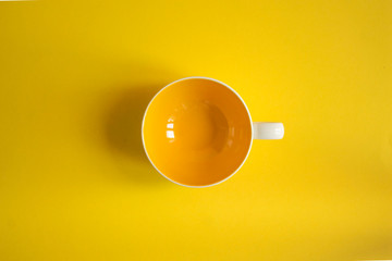 yellow cup on yellow background