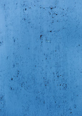 Blue painted wall texture with cracks