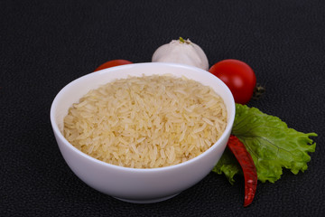 Raw uncooked rice in the bowl