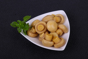 Pickled champignon heap in the bowl