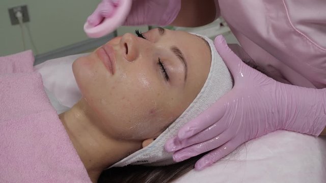 Facial cleansing procedure in a cosmetic clinic.