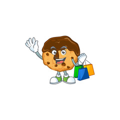A rich chocolate chips with cream cartoon design waving and holding Shopping bag