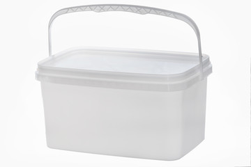 White plastic bucket with handle up on white background. Isolated