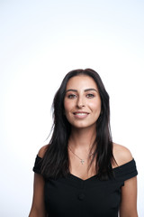 A large portrait of a middle-aged woman (30-35 years old) with dark hair and brown eyes in a black dress on a light background.