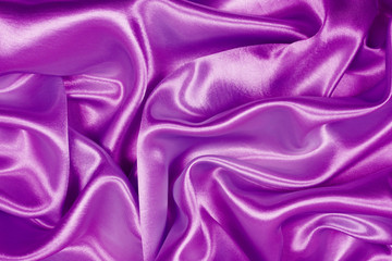 Beautiful purple satin luxury cloth texture can use as wedding background, fabric