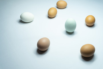 Many eggs are in a white table.