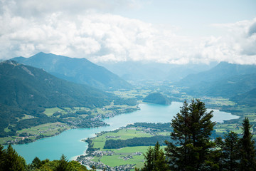 Scenic view of blue lake Wolfgangsee in mountains during summer day, Salzkammergut, Austria