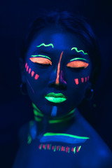 Uv paint make-up on woman's face
