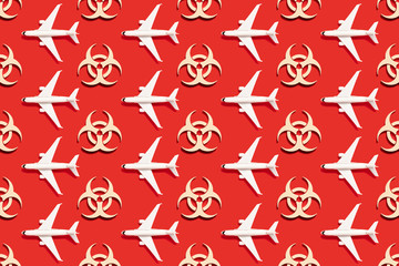 Seamless Pattern of Symbol of biohazard warning on red backdrop. Epidemic coronavirus virus. Biohazard, radioactive, toxic waste.
