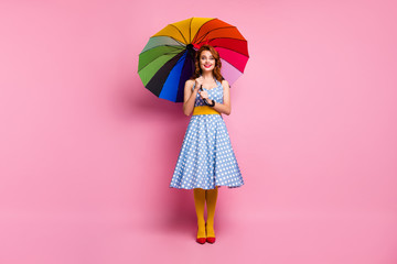Full length photo positive cheerful lady enjoy fall spring rainy meteorology weather hold colorful...