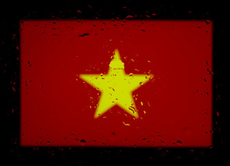 The national flag of Vietnam. Abstract photo with water drops on a black background.