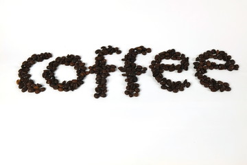 The coffee beans are arranged in alphabetical order and the coffee powder is on a white background.