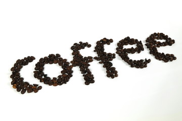 The coffee beans are arranged in alphabetical order and the coffee powder is on a white background.