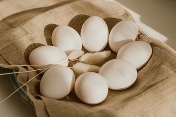 Organic white eggs of chicken on brown sack for background texture in natural light. Easter concept. Concept of organic natural farming.