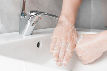 Effective handwashing techniques: rubbing each thumbs. Hand washing is very important to avoid the...