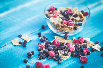 Organic cereals on blue wooden background