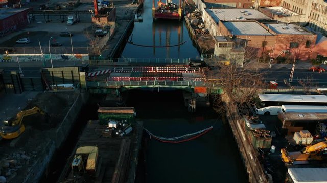 flying over end of Gowanus Canal tilting up to downtown Brooklyn