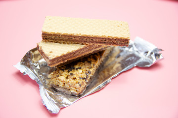 healthy nutrition protein bars on pink and orange background
