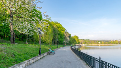 Fototapeta na wymiar Valea Morilor park with Valea Morilor lake in Chisinau, Moldova on a sunny spring day. It is one of the most popular parks in Chisinau, Moldova