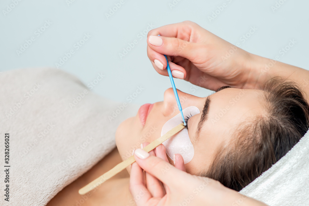 Wall mural Eyelash extension procedure.