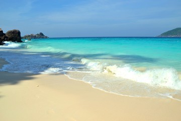 Picturesque exotic beach with white sand and blue clear water