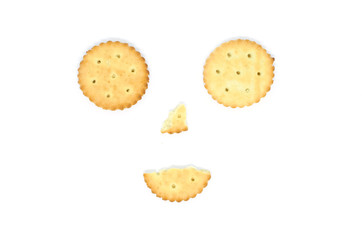 smiling smiley face made of salted crackers isolated on white background