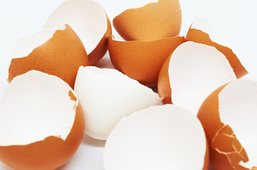 background of broken white and brown shell chicken eggs