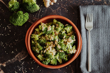A bowl with broccoli and quinoa