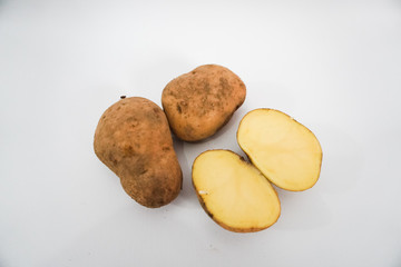 Fototapeta premium Potato vegetables cut on a white background