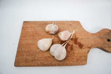 garlic on a wooden tray