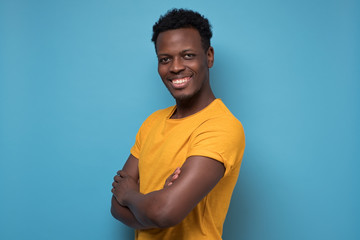 Black african american young man in yellow t-shirt with cheerful attitude