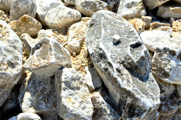 Natural gray gypsum stone. Close up image of stones with black and white. Industrial mining area. Limestone mining, quarry - Image