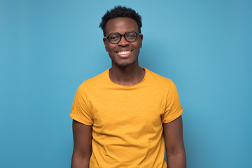 Black african american young man in yellow t-shirt with cheerful attitude - Powered by Adobe