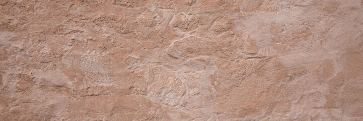 Panoramic texture of a plain wall painted with brown color. Panoramic brown background