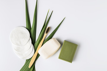 Zero waste, sustainable bathroom and lifestyle. Bamboo toothbrush, natural soap bar, cotton make-up removal pads