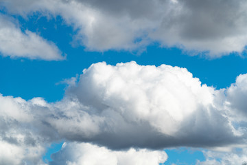 Blue sky with fluffy clouds