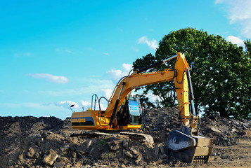Excavator with crusher bucket for crushing concrete. Construction waste recycling for construction...