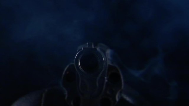 HD - A shot from a revolver. front view close-up