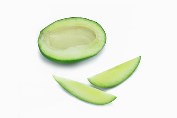 half piece of raw green mangoes with pieces of mango