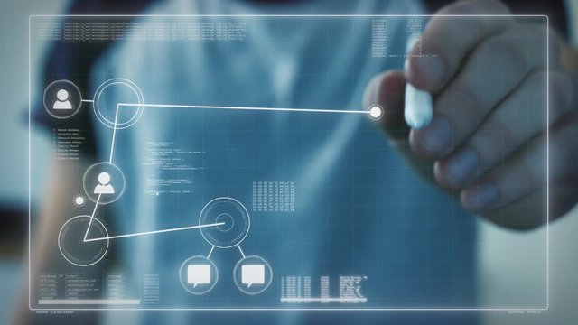 Male hand creates a digital network on a holographic screen using a touch pen. Holographic work screen with nodes, connections and data sets.