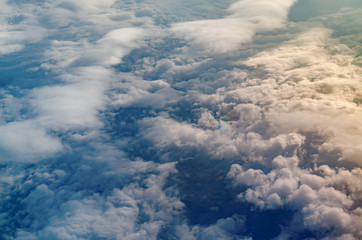 Airplane view to Altocumulus clouds and shadows of them above sea surface.