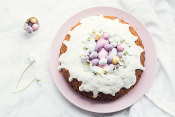 Glazed easter cake with flowers and candy