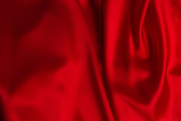 Red silk or satin luxury fabric texture can use as abstract background.