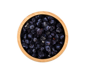 dry rot blueberry in wood bowl on white background