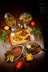 Many different delicious dishes on the table. Various snacks and antipasti on the table. Restaurant menu.Top view