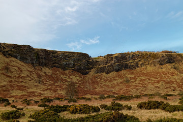 The hidden Grave watchers Building at the Nether Kirkyard Cemetery beneath the Volcanic Cliffs of...