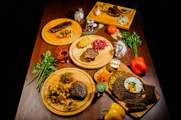 Many different delicious dishes on the table. Various snacks and antipasti on the table. Restaurant menu.Top view