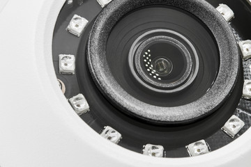 Obraz premium Dome secure camera on light background with motion sensors. Video surveillance camera. Closeup, selective focus