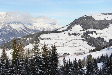 Winter panorama of mountains and forests with sky background